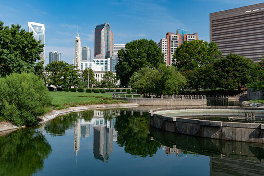 The Charlotte, NC skyline viewed from Marshall Park on a blue sky day in the summer