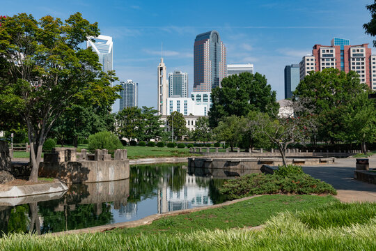 The Charlotte, NC skyline viewed from Marshall Park on a blue sky day in the summer