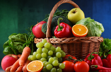 Fresh organic fruits and vegetables in wicker basket