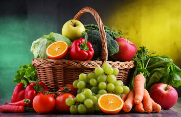 Fresh organic fruits and vegetables in wicker basket