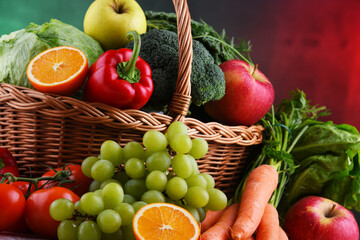 Fresh organic fruits and vegetables in wicker basket