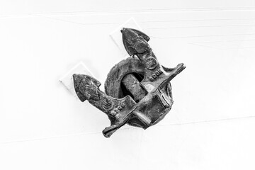 Fototapeta premium Hamburg, Germany. Historic anchor on a white ship wall.