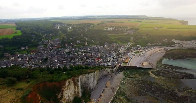 Aerial view of cliffs of Etretat at sunset. Etretat Normandy Shore Sea. France, Normandy, Aerial view of Etretat Aval cliff, rocks and natural arch landmark.