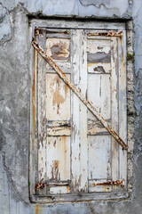 old window painted white oil, paints spilled, iron locked