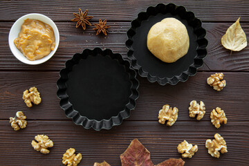 Obraz na płótnie Canvas Bakery ingrediens on brown autumn background, top view. Bright warm colors. 