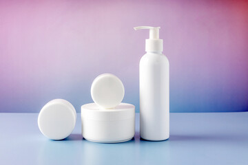 containers for cosmetics on a color gradient background
