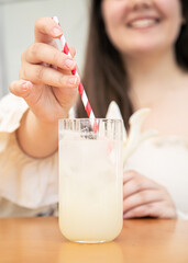 Close-up, a glass with cold lemonade in a cafe on the table.