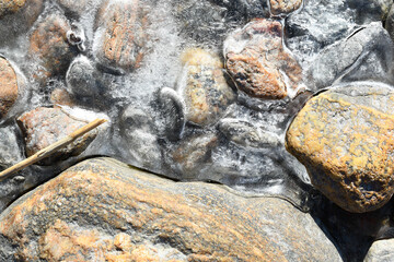 Pebbles and thin ice