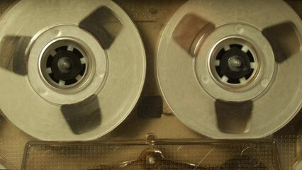 Cassette tape player rolling, close up shot. A vintage music loop template, with a natural color look
