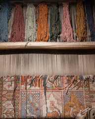 Vertical view of carpet or rug weaving process