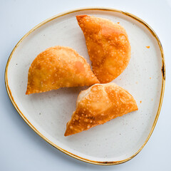 chebureks on a plate top view