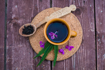 Ivan tea or chai. Herbal tea from fireweed flowers in a cup on natural stone background. Traditional Russian kopor tea.