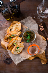 Homemade traditional Italian appetizer tapenade from green and black olives, white ciabatta