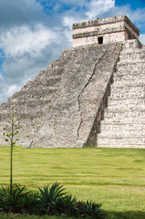 Fototapeta na wymiar Main big pyramid of Chichen Itza archeological Mayan site on the Yucatan peninsula, Mexico. Peaceful and quiet picture shot in the morning without people. 