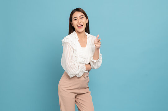 Young Beautiful Asian Woman With Smart Casual Cloth Smiling And Giving Thumbs Up Isolated On Blue Background