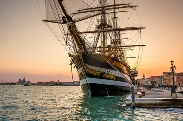 Foto auf Leinwand The famous tall ship Amerigo Vespucci in Venice, Italy during sunset © Christian Schmidt 