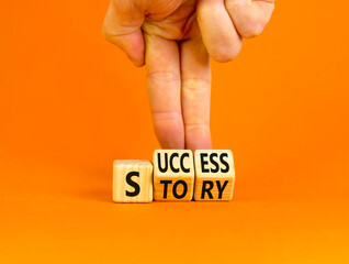 Success story symbol. Concept words Success story on wooden cubes. Businessman hand. Beautiful orange table orange background. Business and Success story concept. Copy space. - obrazy, fototapety, plakaty