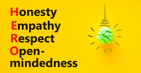 HERO honesty empathy respect open-mindedness symbol. Concept words HERO honesty empathy respect open-mindedness on yellow background. HERO honesty empathy respect open-mindedness concept. - obrazy, fototapety, plakaty