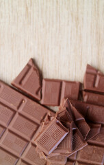 Top View of chocolate chunks piled up on wooden backgroud