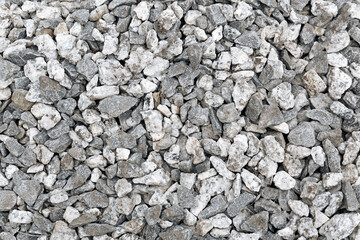 Pile of grey stones as background, top view