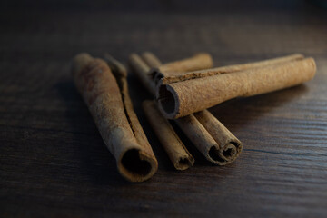 cinnamon sticks on wooden table