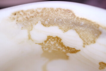 Closeup of coffee traces on a cup after finished drinking 