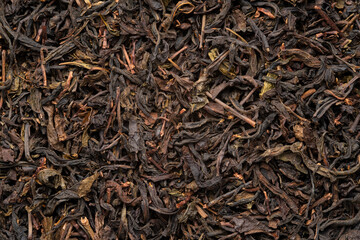 Dried tea leaves for background.low grade and inexpensive price.Top view