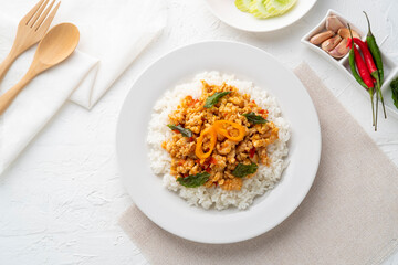 Rice topped with stir-fried minced chicken and basil (Gai Pad Grapow).Thai food.Top view