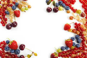 Various fresh summer berries frame on white background. Top view
