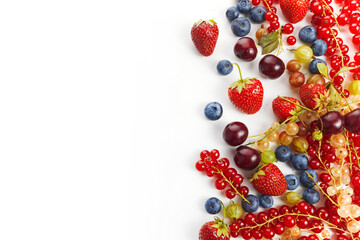 Various fresh summer berries frame on white background. Top view