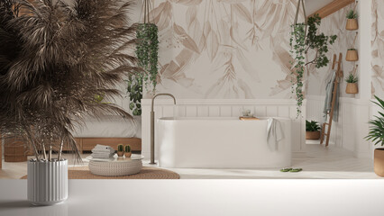 White table top or shelf with straws, dry plants, ornament, ears, sheaf, branch in vase, over bohemian wooden bathroom in boho style. Bathtub and potted plants, interior design