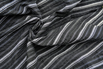 Fragment of a striped fabric .