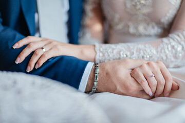 bride and groom holding hands