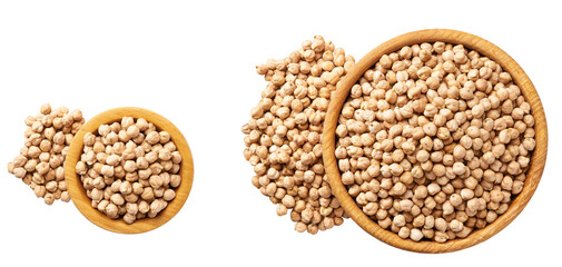 Grains chickpeas are scattered out of the wooden bowl top view.