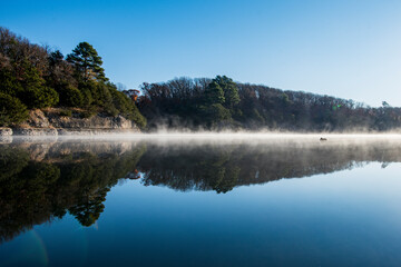 Crystal Lake in Decatur Arkansas with fog on the water