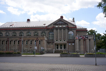 Rakovnik, Czech Republic - July 2, 2022 - modernist building from 1914 with a facade of white unplastered brick - Sokolovna - on a sunny summer afternoon