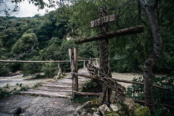 photograph of an old cross made of roots