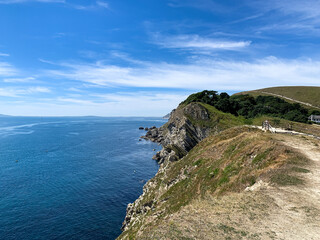 Lulworth Cove cliffs view on a way to Durdle Door. The Jurassic Coast is a World Heritage Site on the English Channel coast of southern England. Dorset, UK.