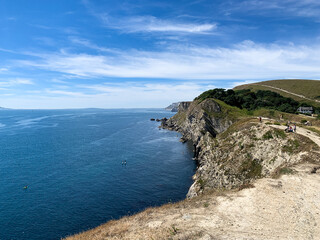 Lulworth Cove cliffs view on a way to Durdle Door. The Jurassic Coast is a World Heritage Site on the English Channel coast of southern England. Dorset, UK.