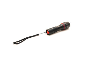 Side view of black aluminum alloy flashlight with lanyards handle isolated on white background