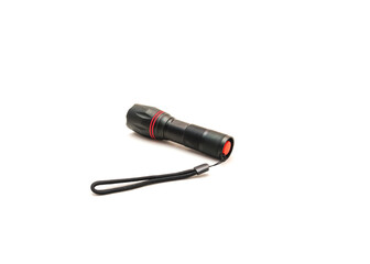 Side view of black aluminum alloy flashlight with lanyards handle isolated on white background