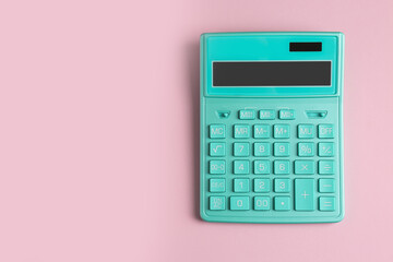 Turquoise calculator on pink background, top view. Space for text - obrazy, fototapety, plakaty