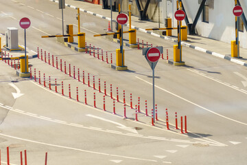 Obraz premium Road with multiple stop signs is prohibited and barriers