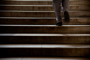 Man Walking On Stairs