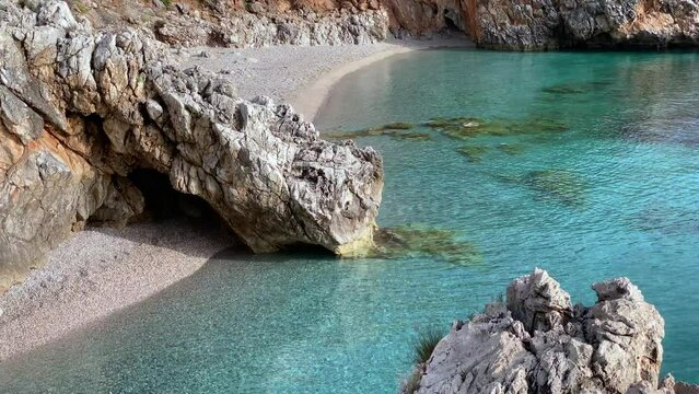 Paradise beach and turquoise sea at "Cala Capreria" into natural reserve &ldquo;Riserva dello Zingaro&rdquo;, Scopello, Sicily, Mediterranean Sea, Italy.