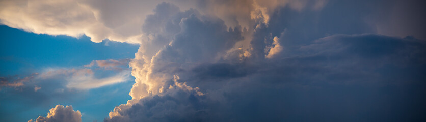 Sky panorama. Beautiful dramatic big clouds in the sky. Landscape of the power of heaven and nature. Copy space