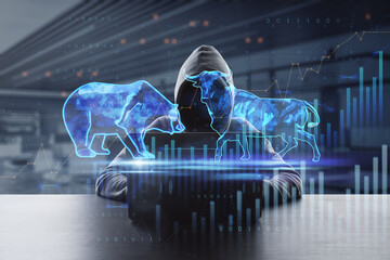  bulls and bears struggle. Equity market illustration. Front view of hacker using laptop at desktop with creative hologram and graph on blurry office interior background. Double exposure.