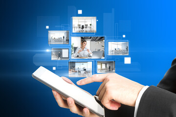 Close up of businessman hand pointing at cellphone with creative digital picture gallery on blue background. Photo album and media technology concept. Switching images.