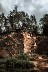 Obraz premium Scenic landscape of river Gauja. Sandy rocks on the shore. Summer nature in Latvia.