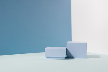 Abstract creative pedestal podium, blue hard shadow background. Minimalism, product showcase, copy...